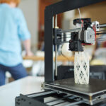 Modern 3d printer with architectural model