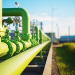 Green hydrogen energy pipeline of green color with industry facility