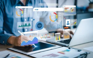 Photo of a person using a computer and dashboard for data analysis