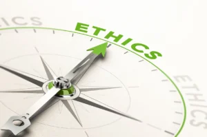 Photo of a compass pointing to the word "Ethics"