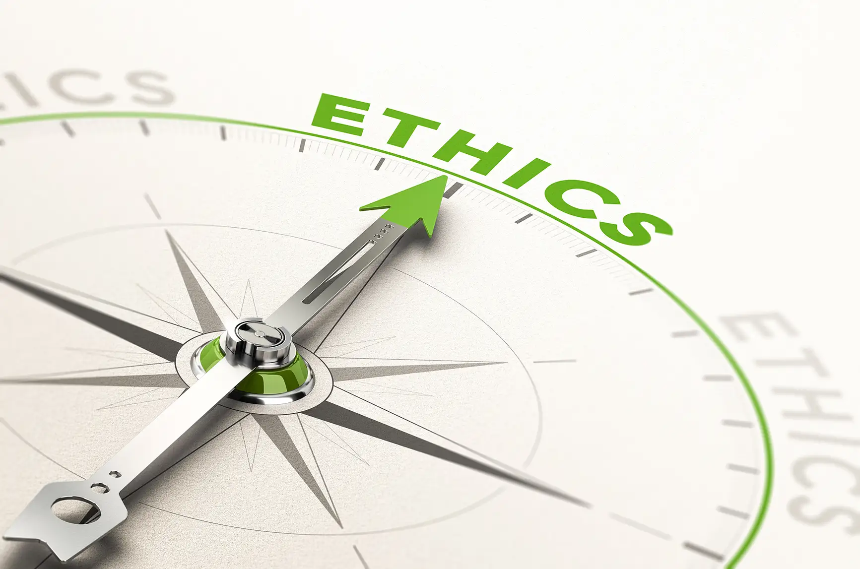 Photo of a compass pointing to the word "Ethics"