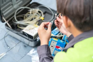 Photo of technician ware sampling tube air quality in reel of machine pump
