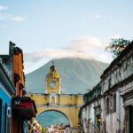 Cityscape of the main street and yellow Santa Catalina arch in the historic city center of Antigua Guatemala