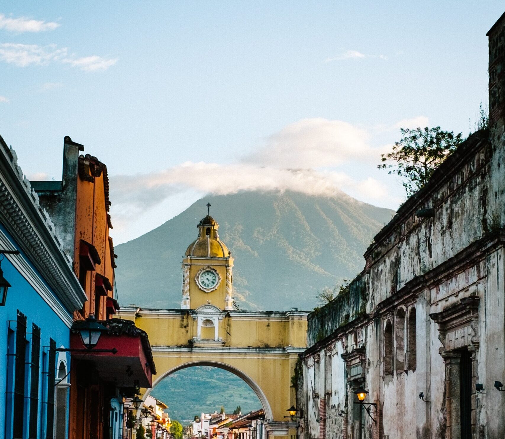 Cityscape of the main street and yellow Santa Catalina arch in the historic city center of Antigua Guatemala