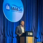 Photo of IAIA CEO Gary Baker speaking during IAIA26 opening plenary