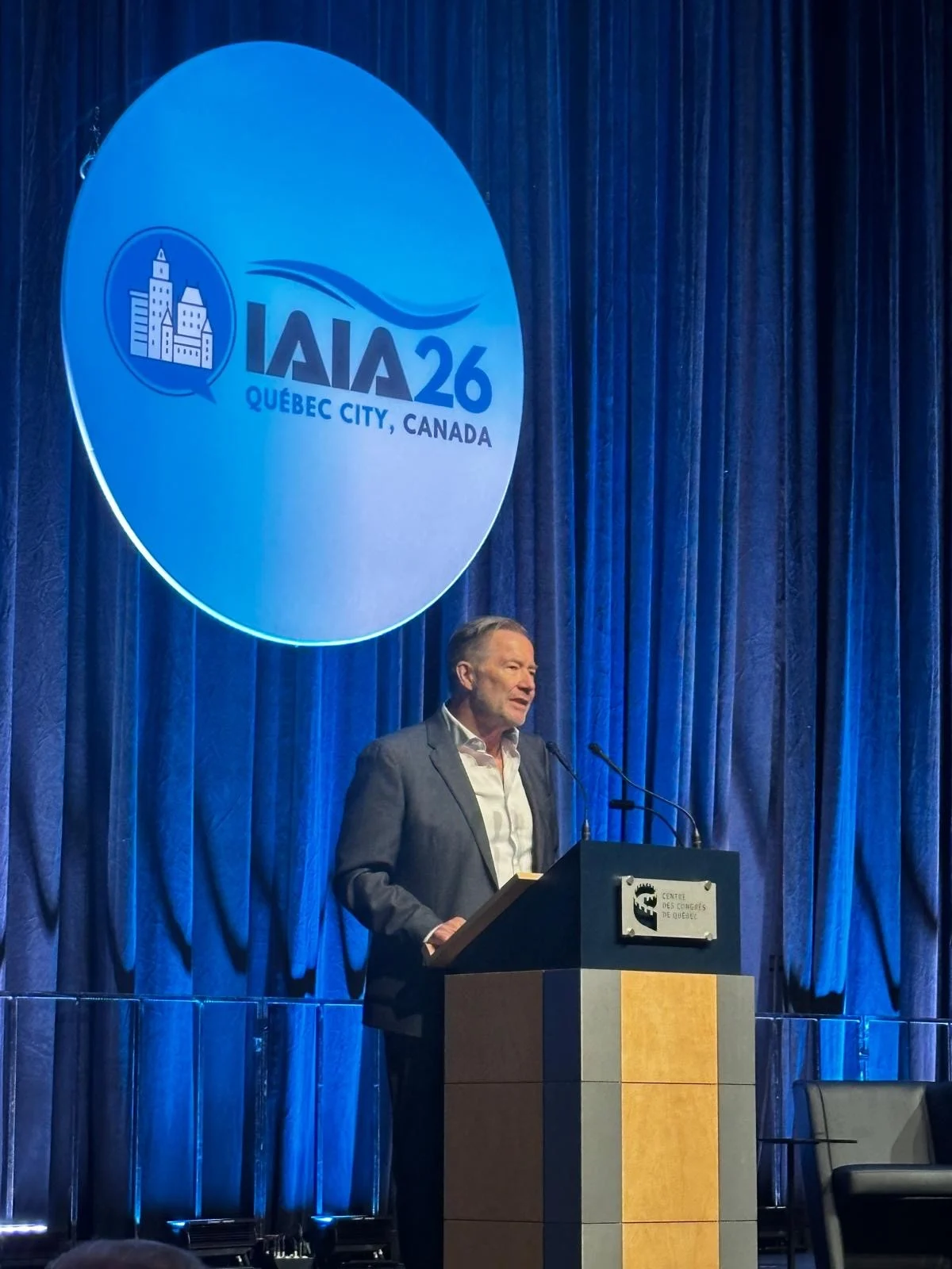 Photo of IAIA CEO Gary Baker speaking during IAIA26 opening plenary