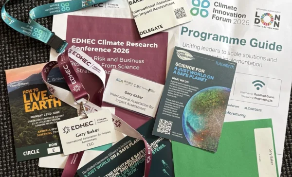 A pile of namebadges from London Climate Action Week 2026