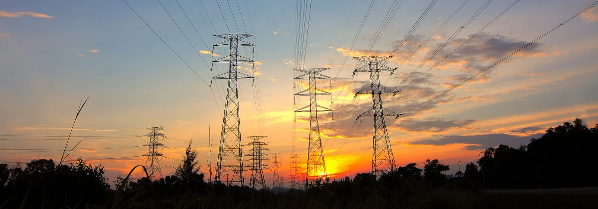 Photo of powerlines at sunset